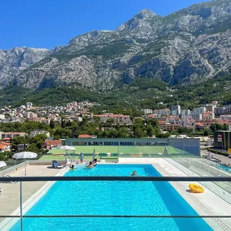 With Shared Rooftop Pool *