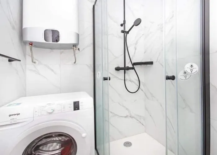 With Shared Rooftop Pool